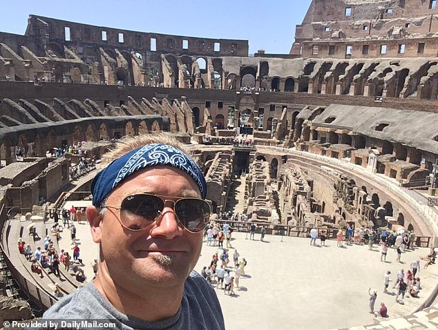 Geographer Ryan Lutz, 38, filmed the tourist carving names into the stone walls of the 1,937-year-old building using a set of keys